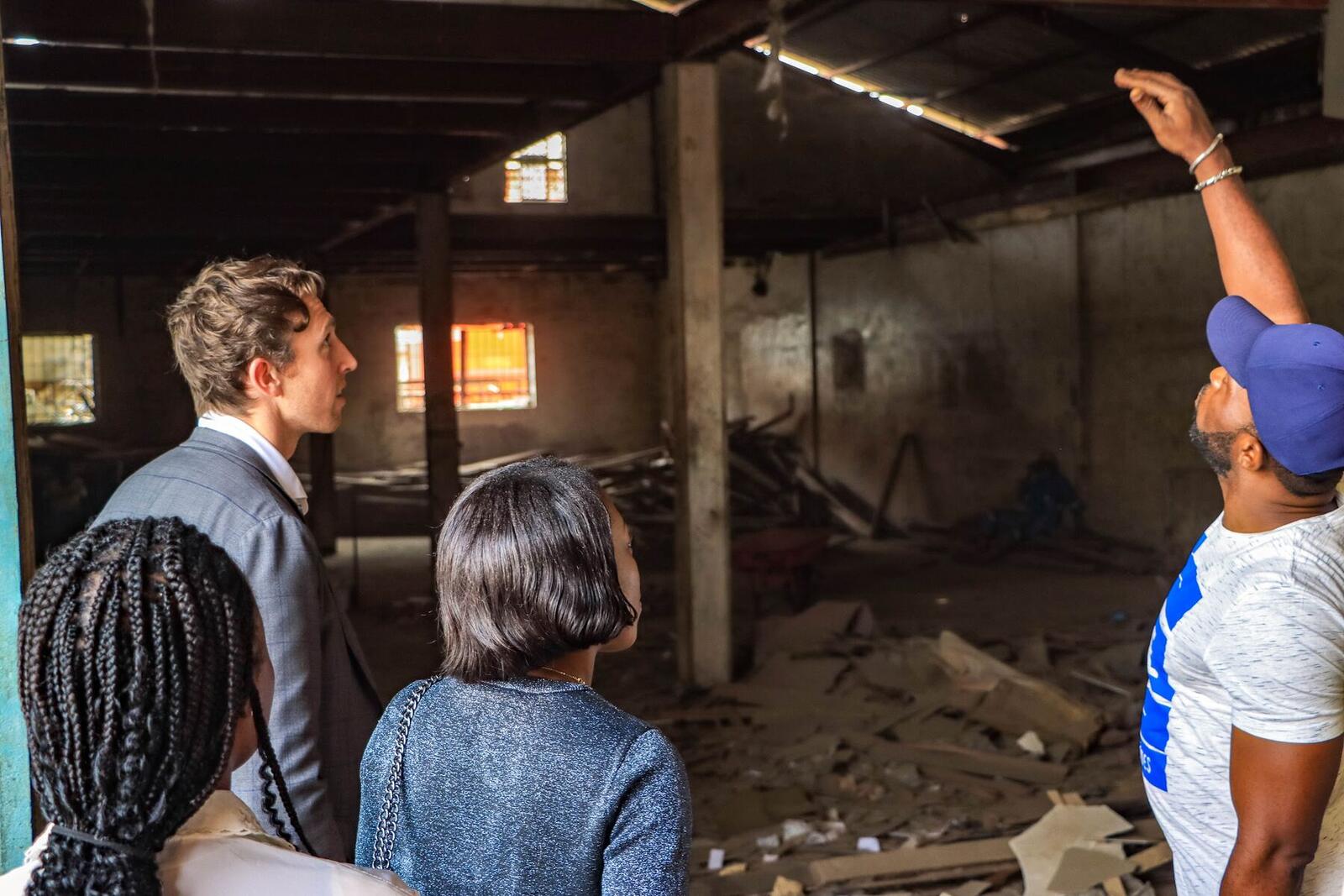 Visitors and staff touring a facility under development