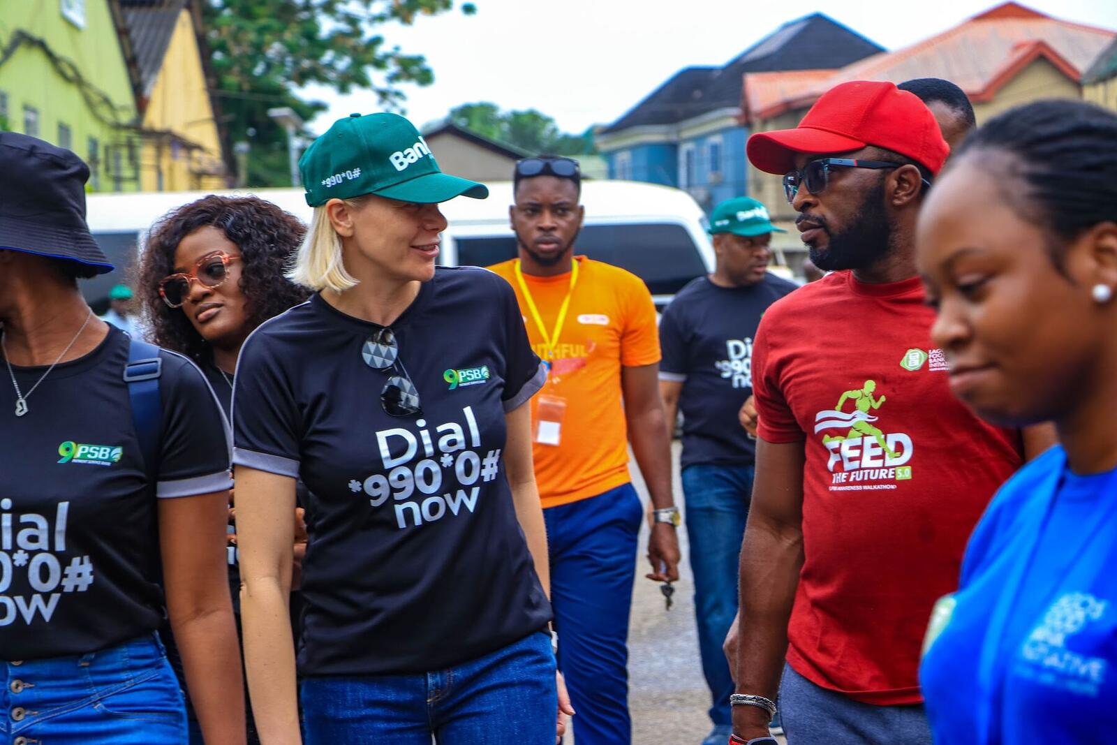 Team members in branded shirts at an outreach event