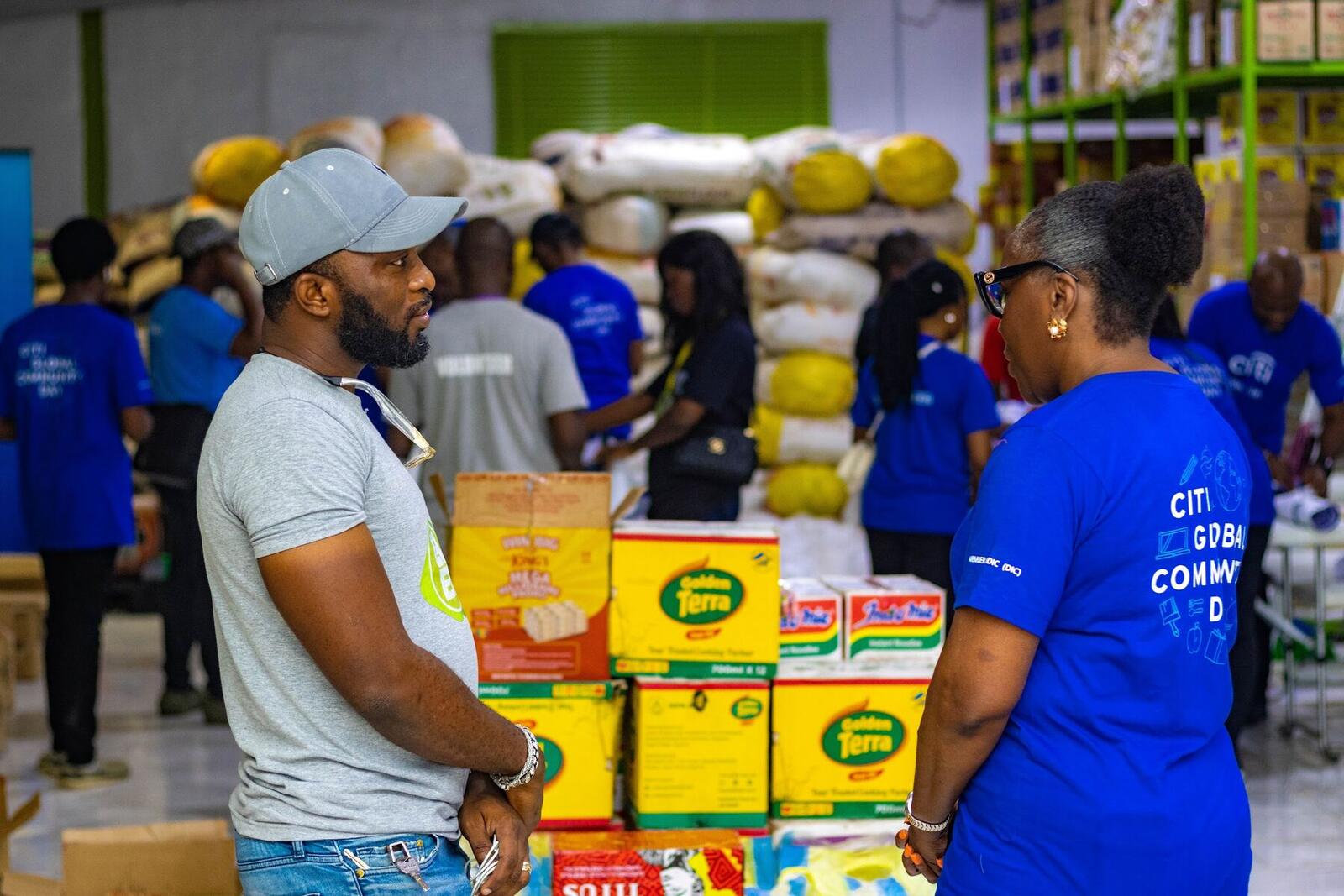 Team members organising stock in a food bank