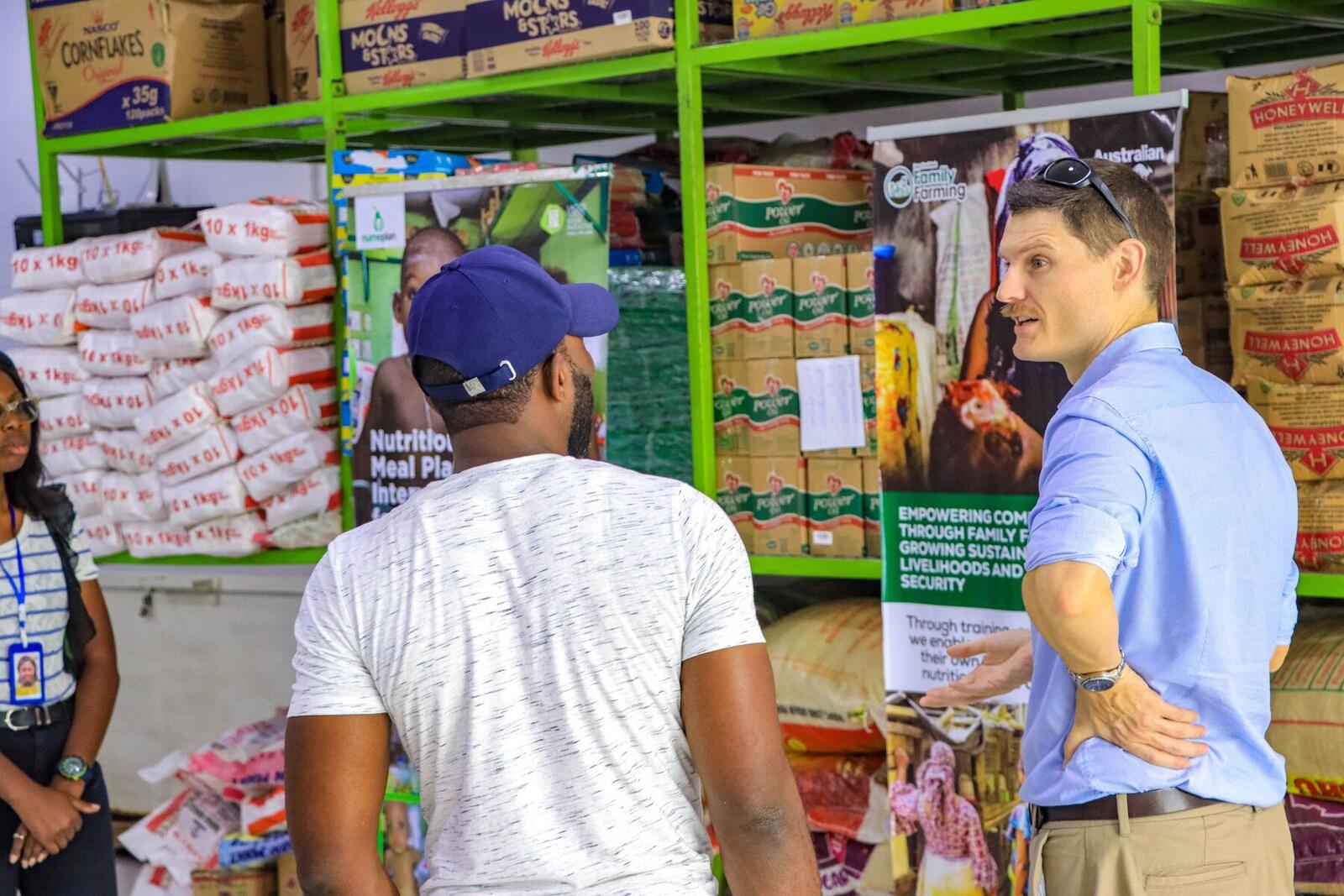 Staff walking through a stocked warehouse